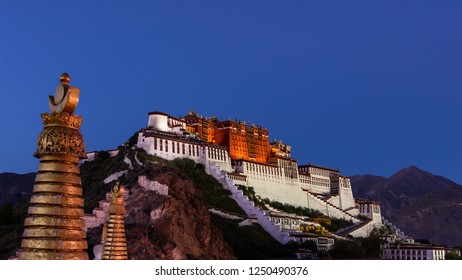 sun set scene of the Potala Palace from the former Lhasa West Gate in Lhasa, Tibet, China. It is now a museum and World Heritage Site. - Powered by Shutterstock