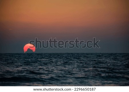 The sun sets at Divegar beach on the west coast of Maharashtra India.