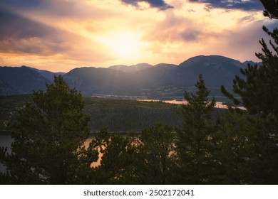 The sun sets in a dramatic fashion over the Rocky Mountains from Sapphire Point above Lake Dillon in Colorado. - Powered by Shutterstock