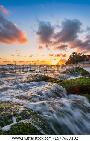 The sun sets at Nam Rin beach, Rayong Province,