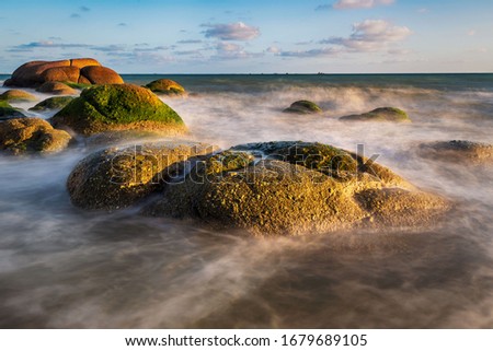 The sun sets at Nam Rin beach, Rayong Province, 