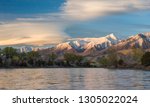 The sun sets on the Paradise Valley as seen from a drift boat on the Yellowstone River in early summer.