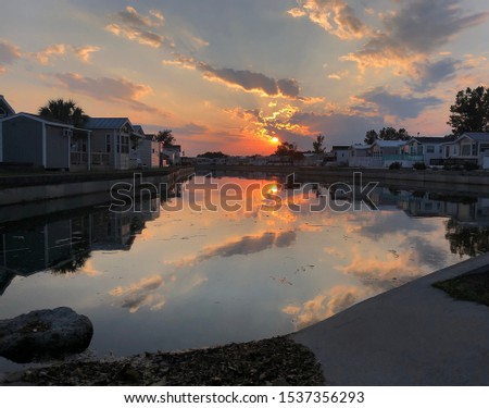 The sun sets over the canal at Goose Creek Campground near Emerald Isle,North Carolina