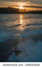 The Sun Sets Over The Lake Ice I=on Lake Defiance At Moraine Hills State Park, McHenry County, Illinois