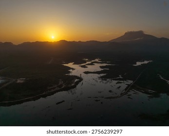 Sun sets over mountain range and winding river,Khlong Hin Reservoir, Ao Luek, Krabi