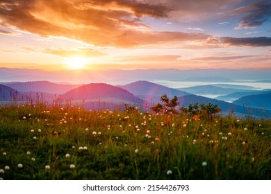 The sun sets over the mountain ranges. Location place Carpathian mountains, Ukraine, Europe. Perfect summertime wallpaper. Image of an magical sunset. Summer vacation. Discover the beauty of earth. - Shutterstock ID 2154426793