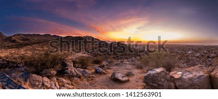 The sun sets over the mountains in Phoenix, Arizona. 