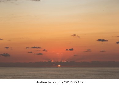 Sun sets over the ocean