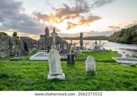 The sun is setting above the Abbey Graveyard which was build by Hugh O Donnell in 1474 - all names and artwork removed