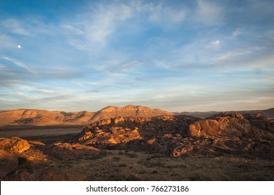 The Sun Setting Across The Mountains At Hueco Tanks In El Paso, Texas. 