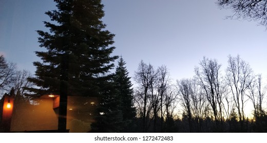 Sun Setting In Alta California With Reflection Of Fireplace Glow