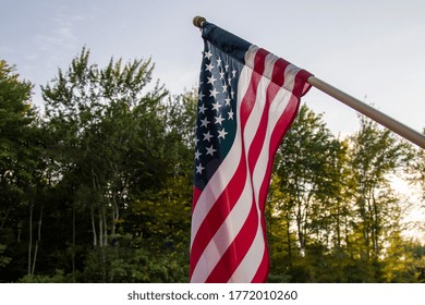 sun setting behind the american