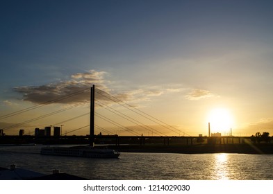 Sun Setting Behind a Bridge