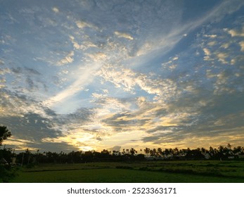 a sun setting behind clouds