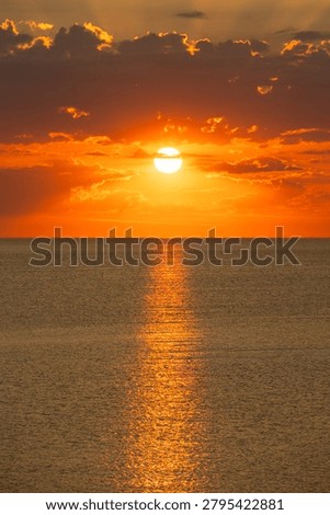 Sun setting behind clouds over the Adriatic Sea with radiant sunbeams, Italy, Roseto degli Abruzzi, 28 May 2026