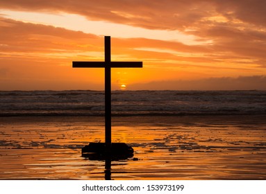 Sun Setting Behind Cross On Beach Stock Photo (Edit Now) 153973199