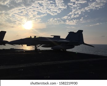 Sun setting behind jet