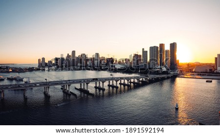 Sun setting behind Miami from a drone over Biscayne Bay near the Venetian Causeway
