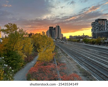 Sun setting behind the train tracks in Toronto, Ontario. - Powered by Shutterstock