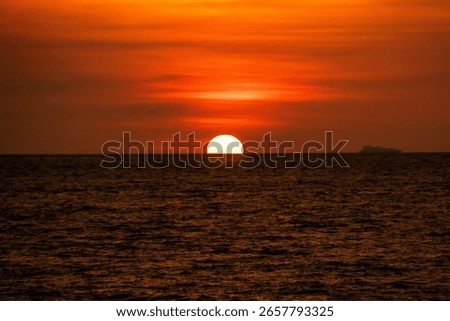 Sun setting down scenery view from beach