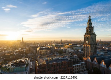 The sun setting at the Martinitoren and the historical city centre of Groningen on a beautiful afternoon.