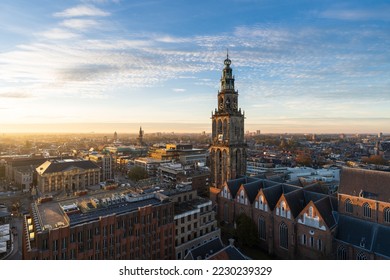 The sun setting at the Martinitoren in the historical city centre of Groningen on a beautiful afternoon. 