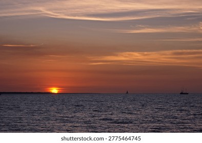 Sun setting at Mindi Beach in Darwin, Northern Territory, Australia.