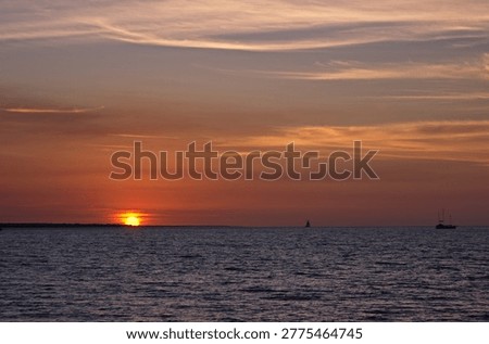Sun setting at Mindi Beach in Darwin, Northern Territory, Australia.