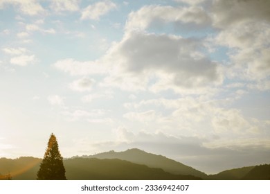 the sun setting on a mountain