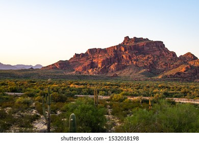 The Sun Setting On Red Mountain In Mesa Arizona.