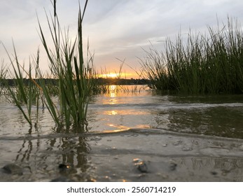 Sun Setting Over A Bay