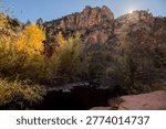 The sun setting over the cliffs above Wet Beaver Creek in Coconino National Forest Arizona.