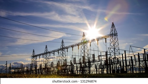 Sun Setting Over An Electrical Substation.