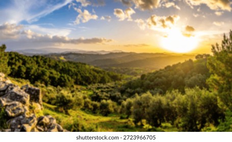 Sun setting over green rolling hills with trees and blue skies filled with white clouds.