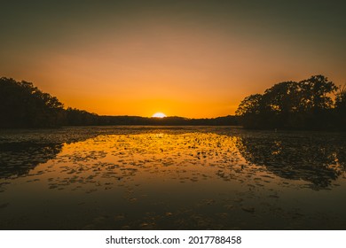 Sun setting over a lake