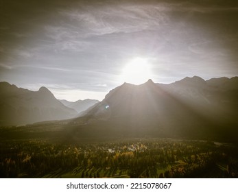 Sun setting over a mountain