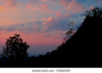 Sun is setting over the mountain.