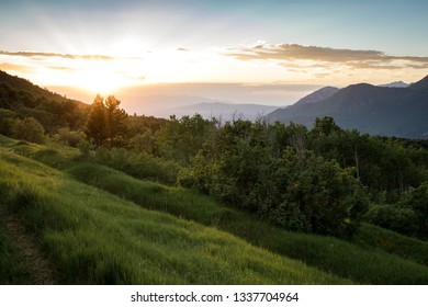 sun setting over mountains