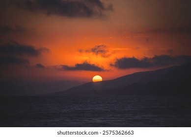 sun setting over the ocean