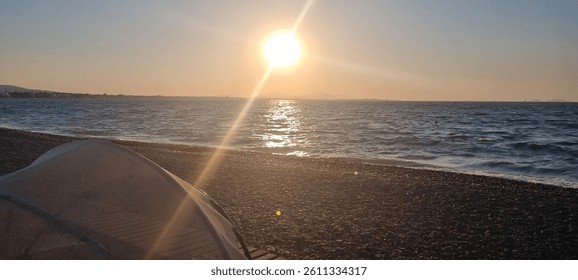 sun setting over the ocean