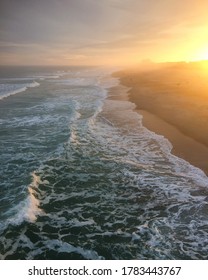 Sun Setting Over Ocean Waves