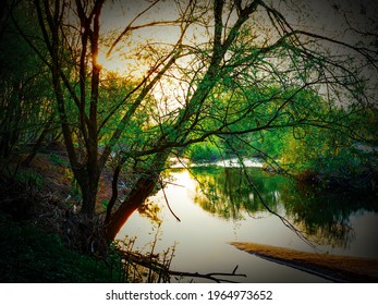 Sun setting over a river