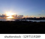 The sun setting over the sea