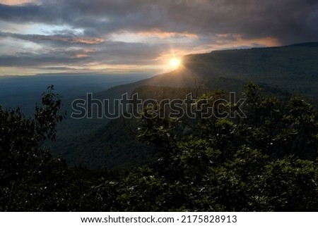 Sun setting over the Shawangunk Mountain range in New Paltz, New York.