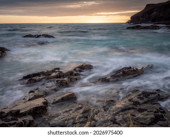 The Sun Setting Over Slate Ledges On The North Cornwall Coast