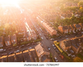 Sun setting over a traditional British neighbourhood. Lens flare and warm colours to give a homely effect. - Shutterstock ID 737841997