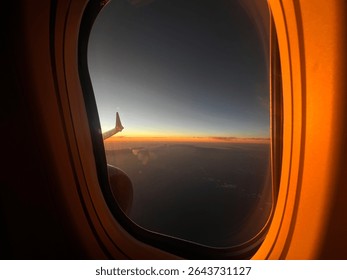 Sun setting plane window view