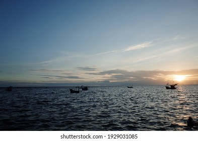 The sun is setting, the sky and the sea are darkening. - Shutterstock ID 1929031085