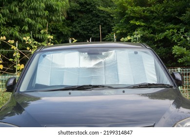  Sun Shade Or Sun Reflector On The Windshield The Car. Osculum Type