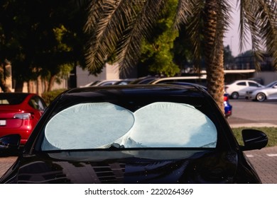 Sun Shade Or Sun Reflector On The Windshield The Car Protective Reflective Surface Under The Windshield Of The Passenger Car Parked On A Hot Day, Heated By The Sun's Rays Inside The Ca